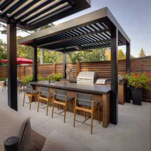Sleek Neolith sintered stone outdoor kitchen countertop with a modern mitered edge in a Sarasota home.